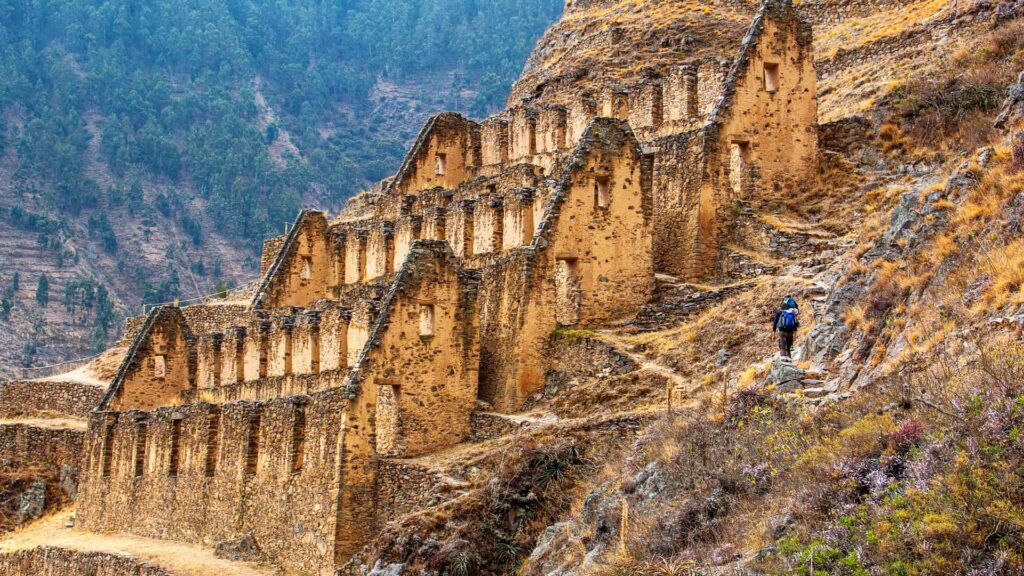 Stone granaries on a steep mountainside overlooking the town.