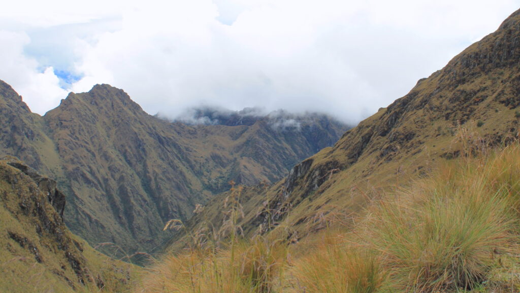 Panoramic view of Warmiwañusca Pass with dramatic mountain scenery and lush valleys in the Peruvian Andes