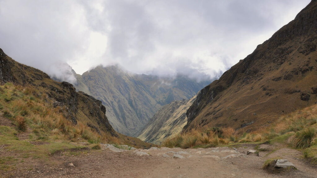 Cloudy and misty conditions at Warmiwañusca Pass creating a mystical ambiance on the Inca Trail