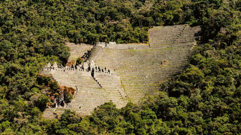 Kancha-style Inca structures at Wiñay Wayna with rectangular stone enclosures.