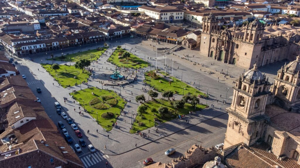 Expansive panoramic view of Cusco, Peru, highlighting the city as a key acclimatization point to prevent altitude sickness before Andean treks - Authentic Incan Adventures